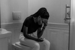 worried young black girl with unplanned pregnancy